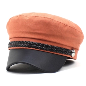 Women's orange canvas navy hat with black leather brim and decorative braided cord details