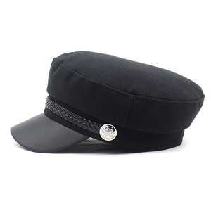 Women black wool newsboy cap with leather brim and silver metal buttons detail