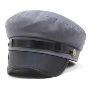 Klassieke grijze newsboy pet met zwarte PU-leren klep en metalen knoop aan de zijkant