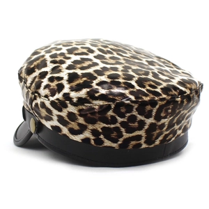 Leopard print newsboy cap with black leather visor and gold button detail