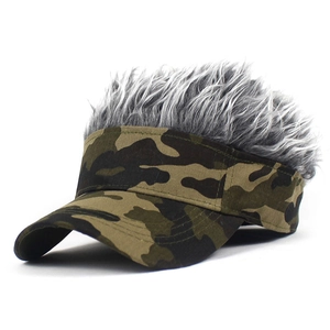 Close-up of camouflage visor with thick grey synthetic hair top on a white background
