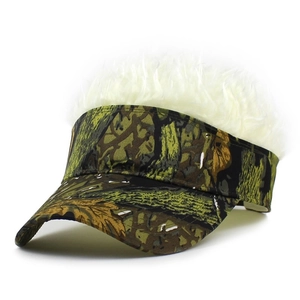 Detail of woodland camo visor cap featuring creative white synthetic hair wig on top