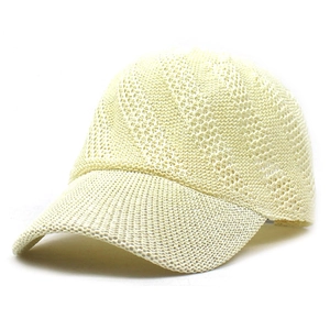 Detail view of beige paper woven sun hat with breathable mesh texture and curved brim