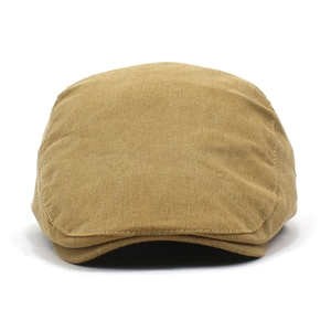 Detailed close-up of khaki cotton twill fabric texture on a classic flat cap for men