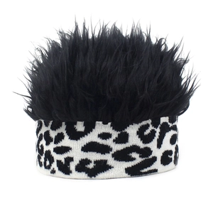 Detail of the leopard print knitted headband with fluffy black synthetic hair extensions
