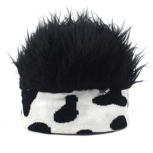 Detail of the knit headband featuring black faux fur wig top and cow print pattern