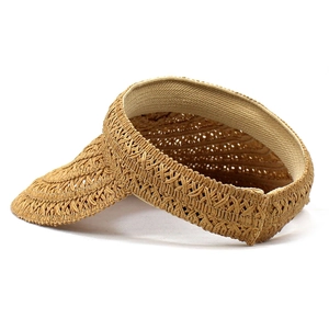Detailed macro view of handcrafted paper straw sun visor with woven texture and sweatband