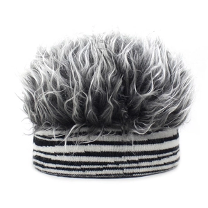 Detailed view of the fuzzy faux fur top and striped knit band on the winter wig hat