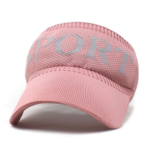 Detail of pink knitted visor with SPORT text showing breathable mesh fabric and curved brim