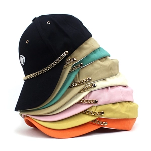 Fashionable baseball cap with gold chain and embroidery detail in multiple colors