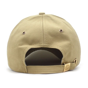 Detail of khaki baseball cap featuring metal buckle adjustment and twill fabric texture