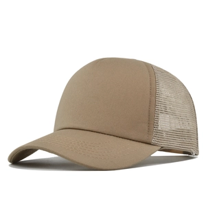 Close-up of khaki trucker hat showing breathable mesh and cotton canvas texture