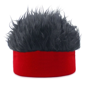 Close-up of red knit base with dense black faux hair texture for funny novelty hat