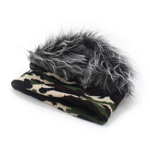 Detailed view of camo knit beanie with grey faux fur hair trim for outdoor style