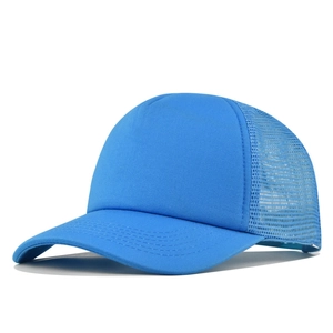 Detail of light blue trucker hat showing reinforced stitching on curved brim and mesh
