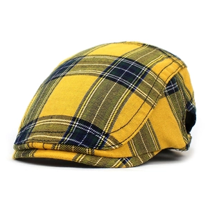 Close-up of yellow British plaid beret showing detailed cotton weave and stitching