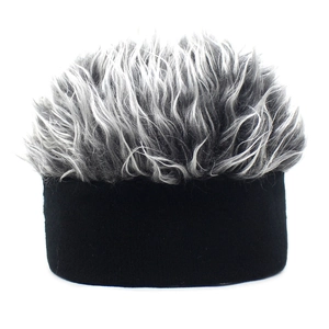 Detailed close-up of a black knit beanie with grey faux hair spikes for outdoor parties