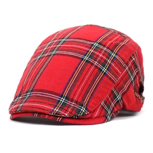 Close-up of red plaid cotton beret showing detailed twill fabric texture and stitching