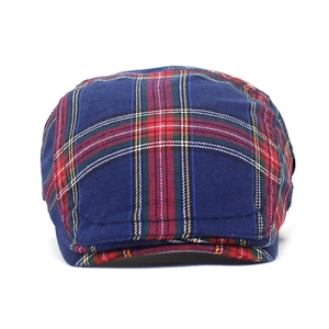 Classic British plaid newsboy cap in navy blue with red and green patterns