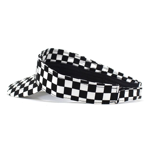 Black and white checkerboard sun visor hat with adjustable strap and open top design