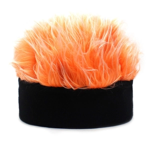 Detailed view of the winter knit hat featuring vibrant orange and black faux hair texture
