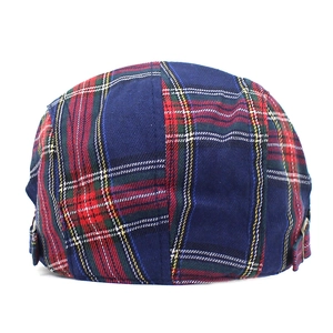 Classic British plaid newsboy cap with adjustable metal buckle and woven cotton texture