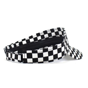 Detail view of checkerboard sun visor hat showing adjustable velcro strap and premium sewing