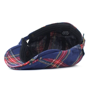 British style plaid newsboy cap in navy blue cotton shown from an interior angle view