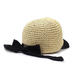 Summer woven straw sun hat for women with an elegant large black bow detail