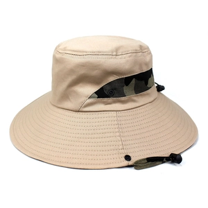 Detail of khaki sun hat featuring camouflage mesh panels and adjustable wind cord