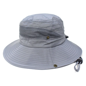 Close-up of breathable mesh band and durable metal snaps on a dark grey sun hat