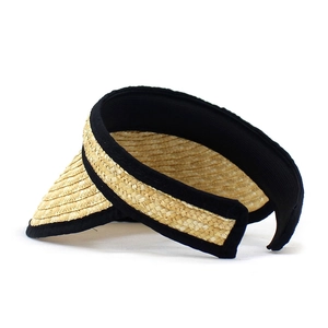 Straw sun visor hat with wide brim and black ribbon trim on white background