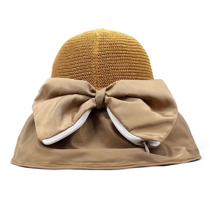 Women's UV protection straw sun hat with large bow detail and wide khaki brim