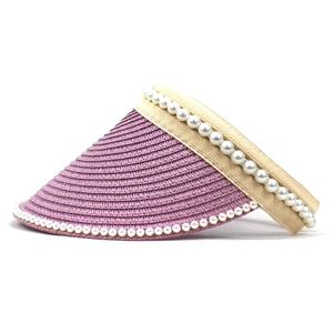 Detailed side view of purple straw sun visor with pearl accents and woven texture