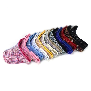 Detail of colorful rhinestones on various summer sun visors with curved brims