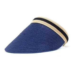 Detailed view of the blue straw sun visor featuring a spiral weave and striped band decoration