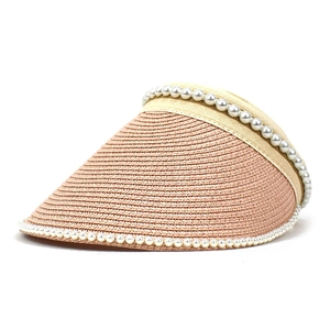 Detailed view of women straw sun hat with woven texture and elegant pearl trim