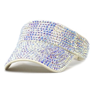 Detail of summer sun visor with colorful rhinestones and off-white knit texture