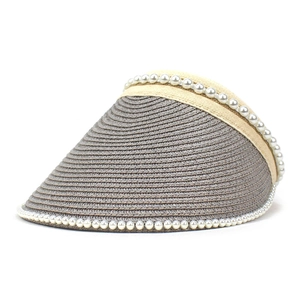 Detail of grey woven straw sun hat with pearl trim and breathable open top design