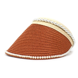 Detailed view of the brown straw sun visor with elegant white pearl trim decorations