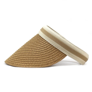 Detail of hand-woven straw visor featuring dark brown and cream white stripe pattern
