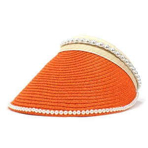 Detail of orange straw sun visor with pearl embellishments and gold silk ribbon
