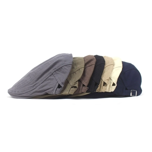 Collection of colorful cotton newsboy caps featuring adjustable metal side buckles