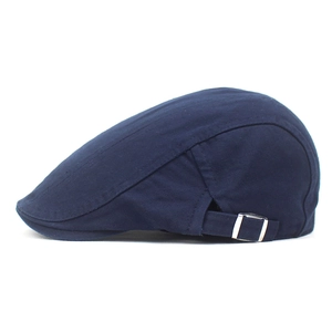 Detailed side view of navy cotton beret hat featuring an adjustable silver metal buckle
