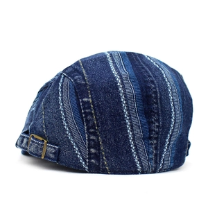 Rear view of denim patchwork ivy cap with adjustable vintage bronze metal buckle detail