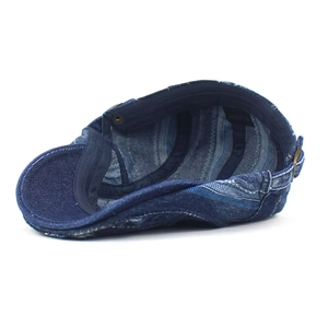 Denim blue cotton flat cap with internal view showing 100% cotton label and stitching