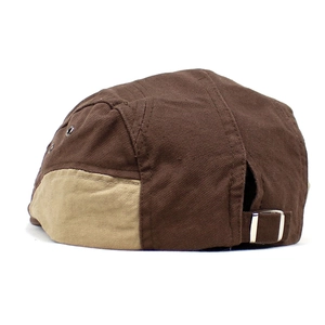 Detail of five-panel cotton baseball cap with contrast stitching and metal back buckle