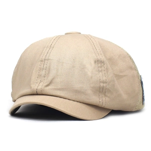 Detail of khaki newsboy hat showing mesh stitching and premium cotton twill texture