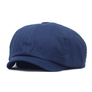 Navy blue breathable mesh newsboy cap with multi-panel stitching and curved brim