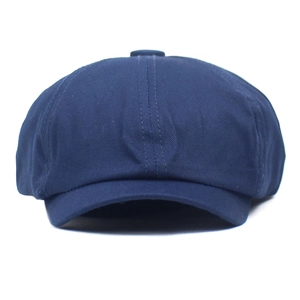 Front view of dark blue newsboy cap featuring breathable mesh and eight-panel crown
